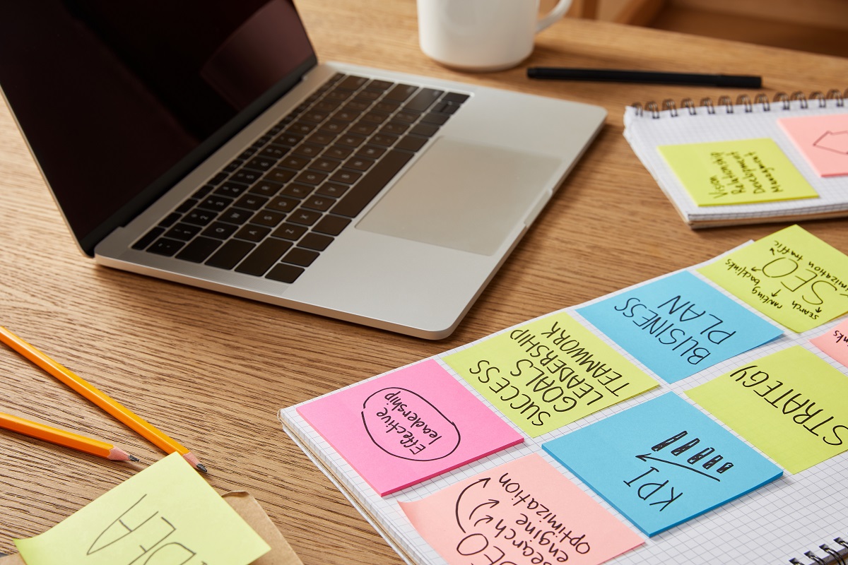 sticky notes laptop office workflow