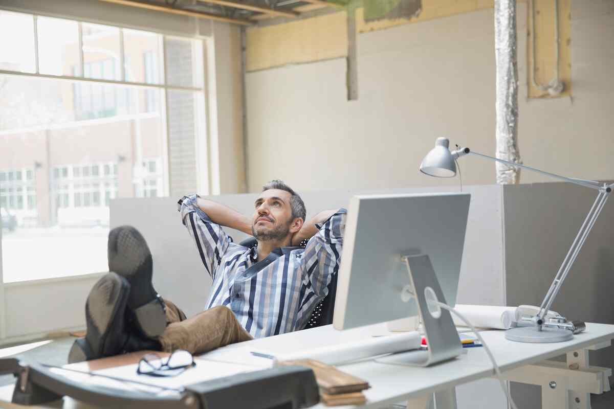 man relaxing after automated work through kyrios systems all in one platform