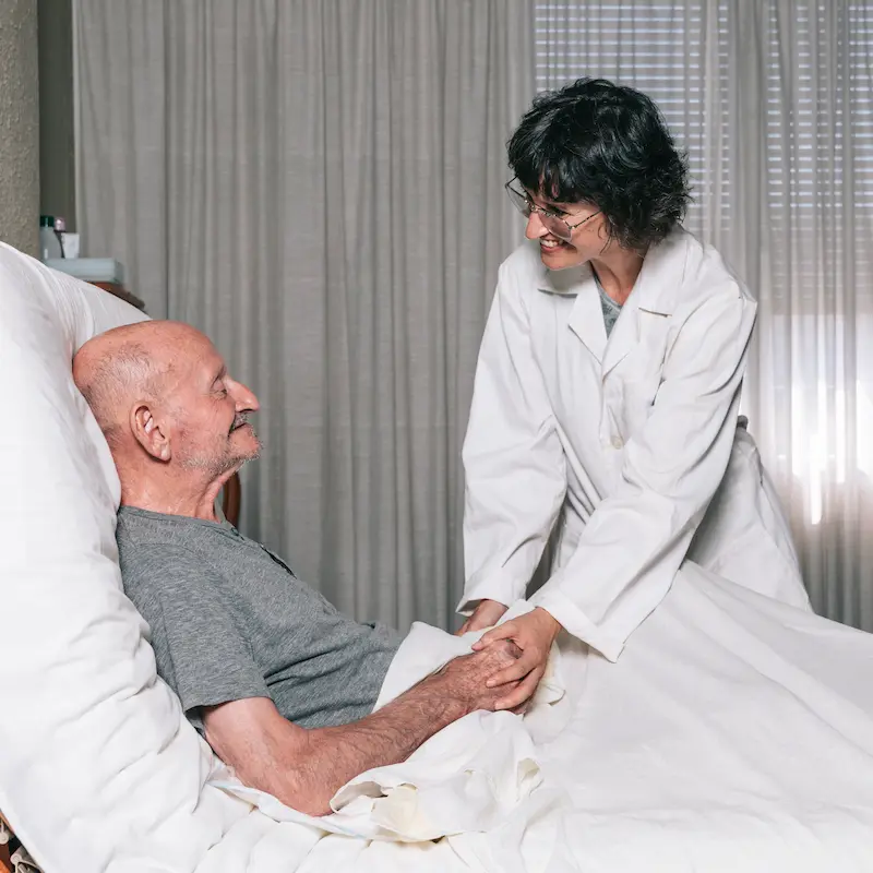Provider discussing non-surgical pain management options with a patient
