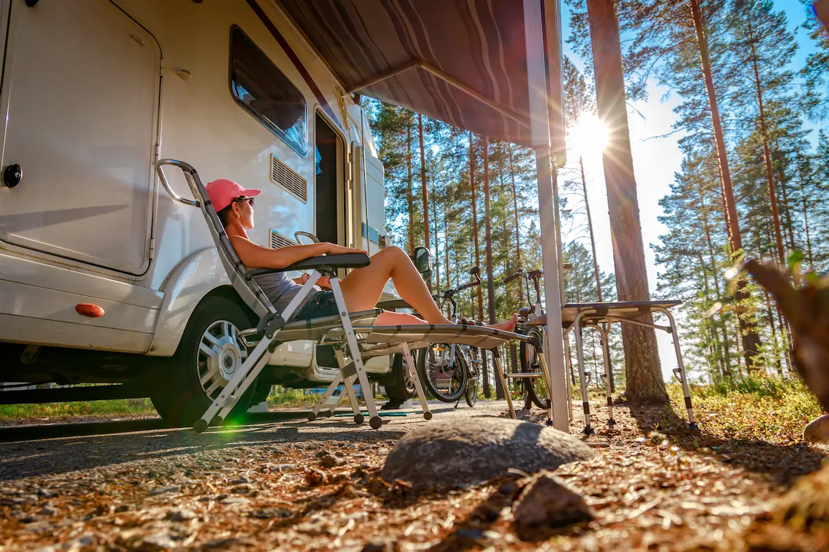 Modern recreational vehicle parked at a scenic campsite
