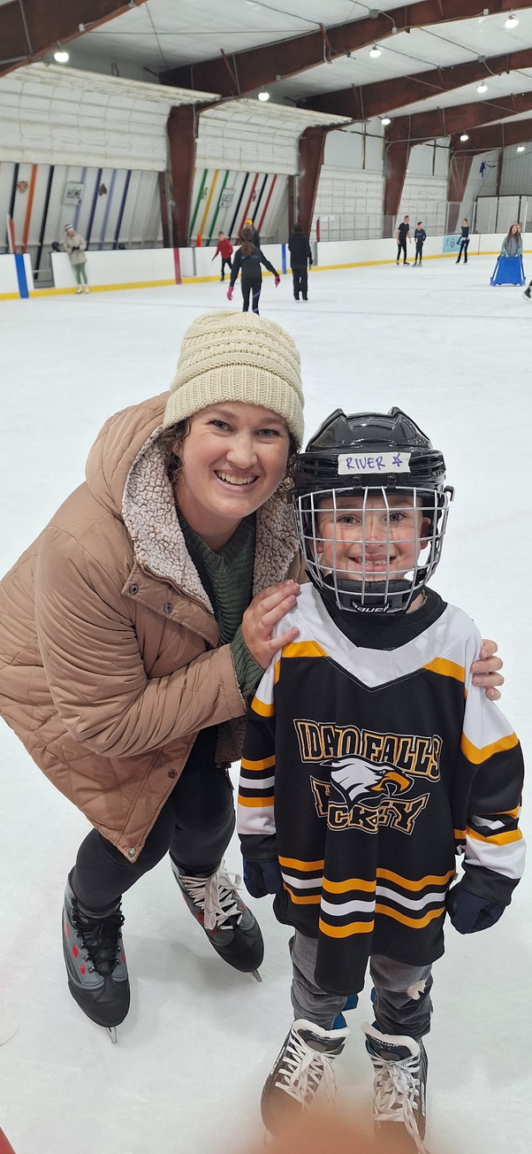 Kelly with her son in hockey gear