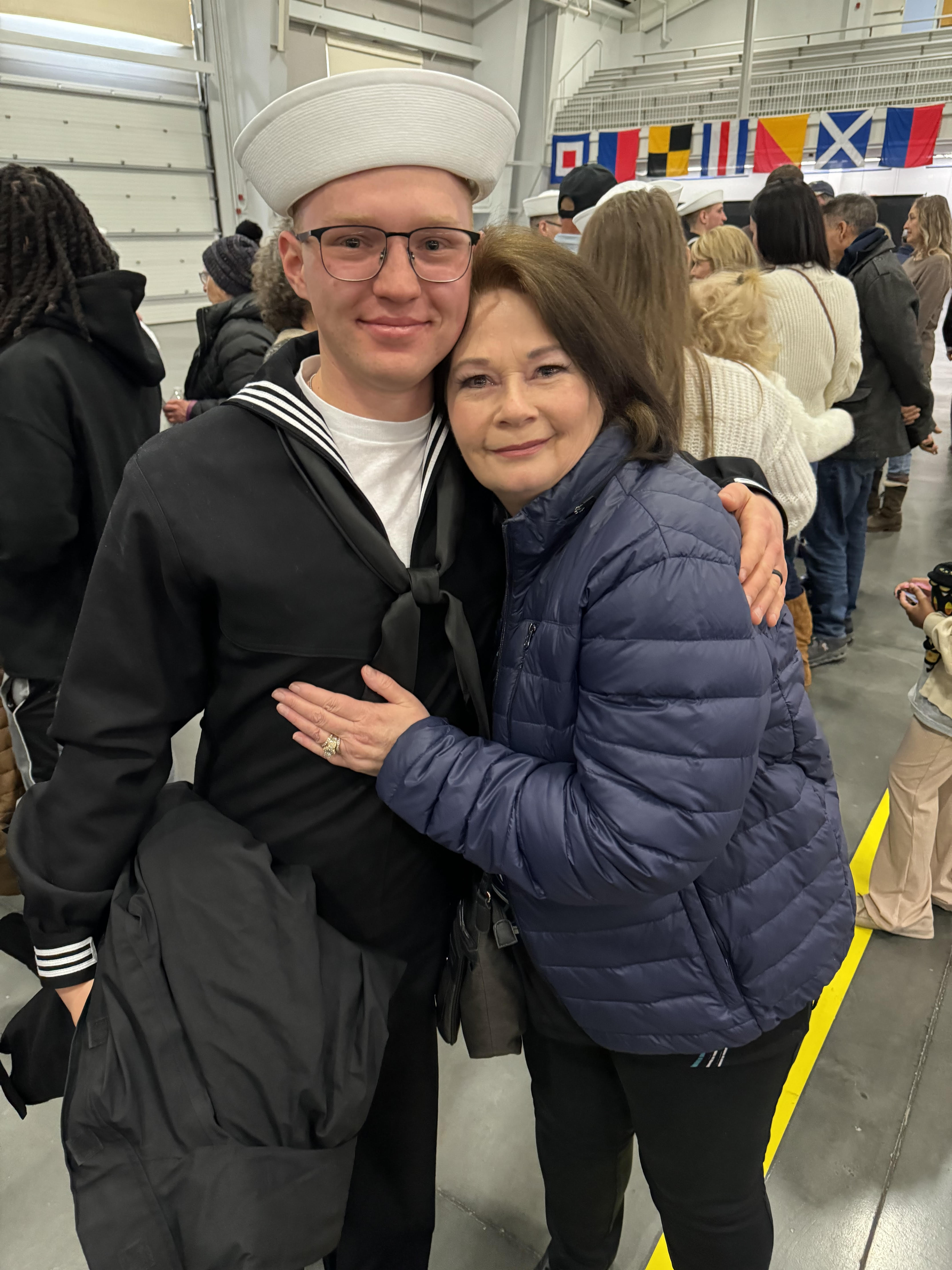 Sheila with her grandson at Navy graduation