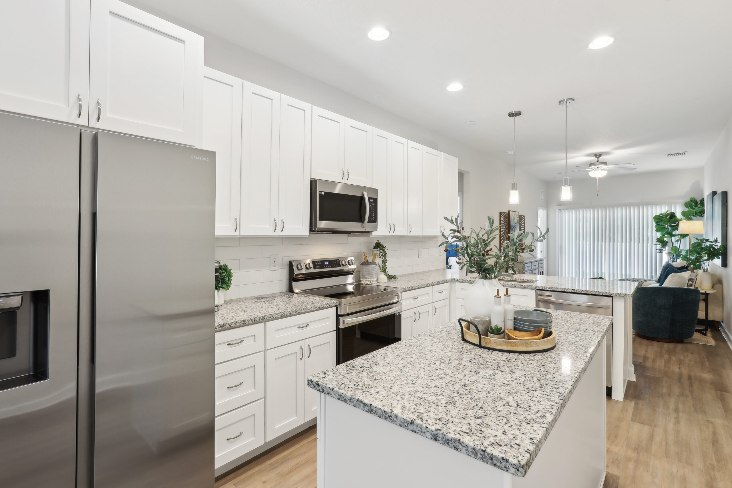Kitchen with island opening to the living room
