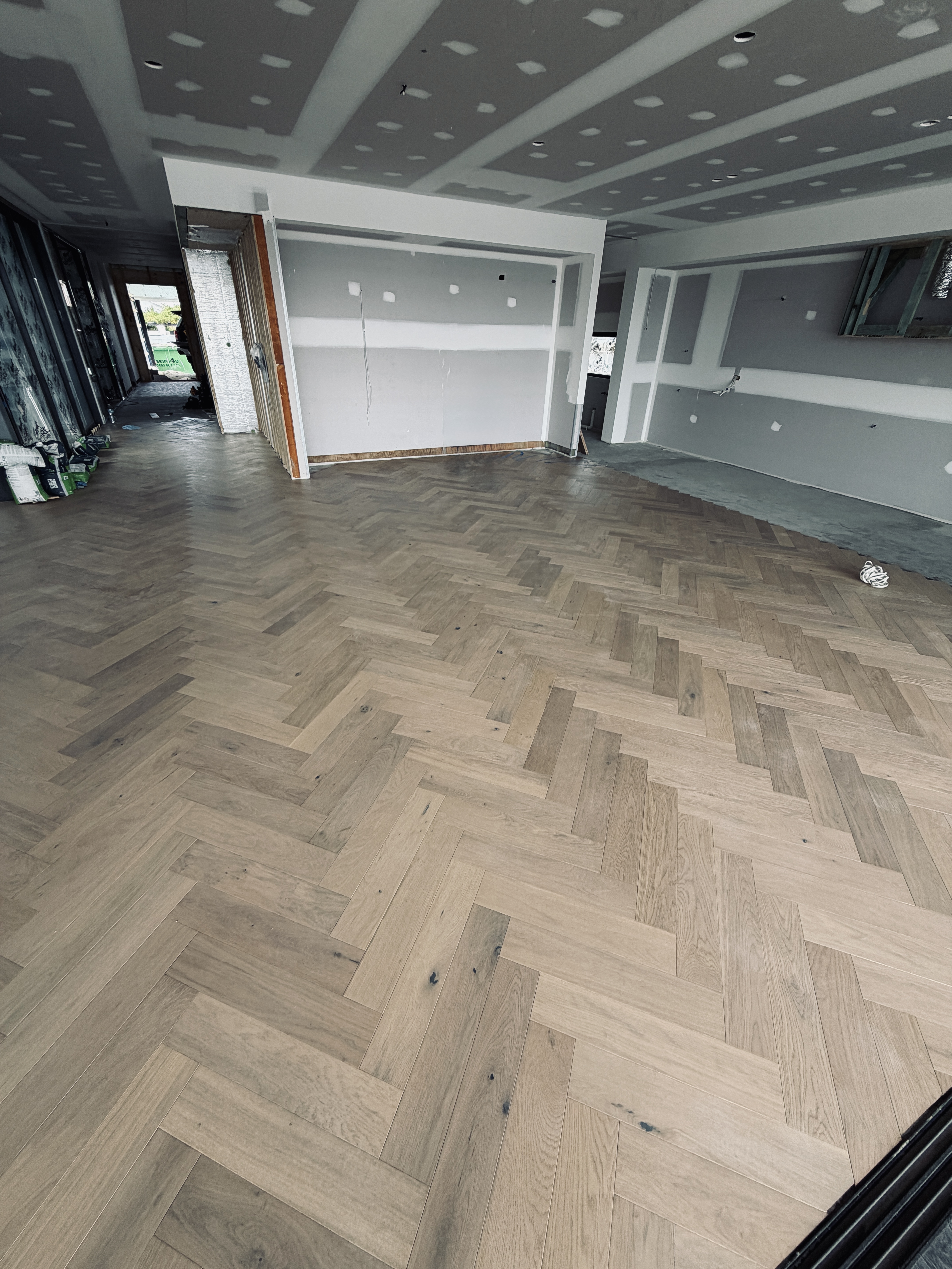 Broadbeach apartment after flooring, herringbone oak pattern