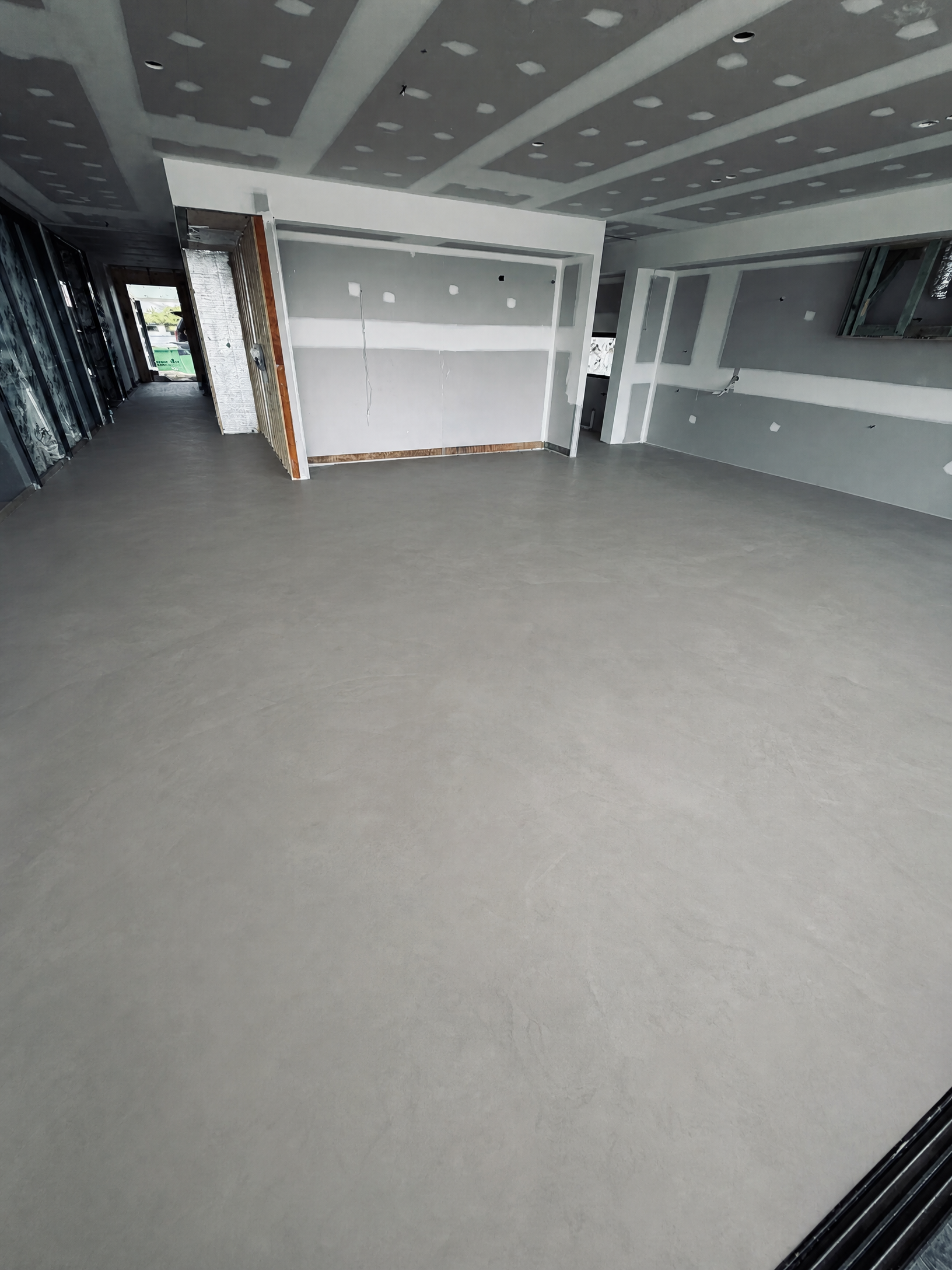 Broadbeach apartment before flooring, bare concrete subfloor