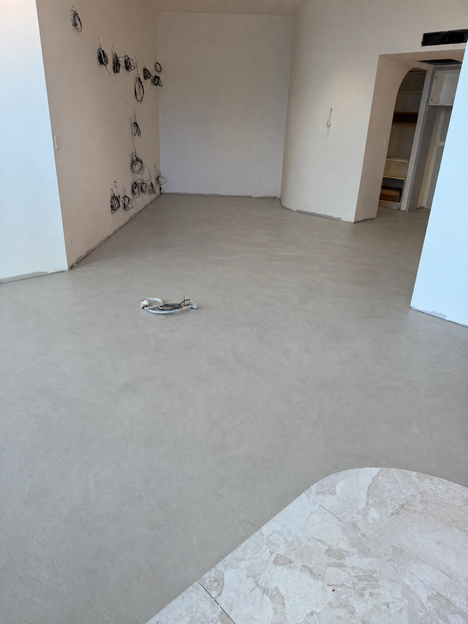 Kirra apartment before flooring, bare screed subfloor