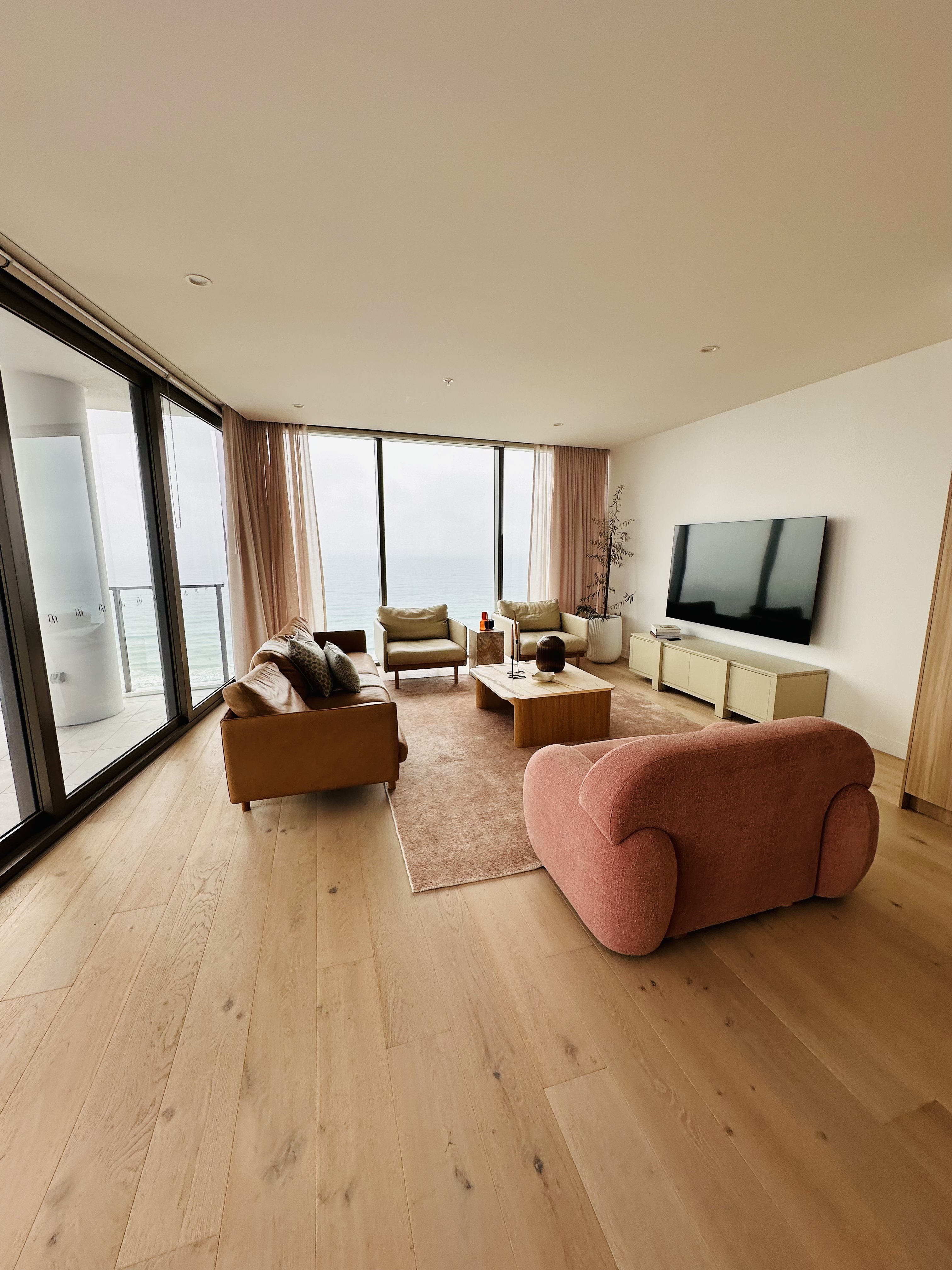 Burleigh apartment after flooring, wide-plank timber living room