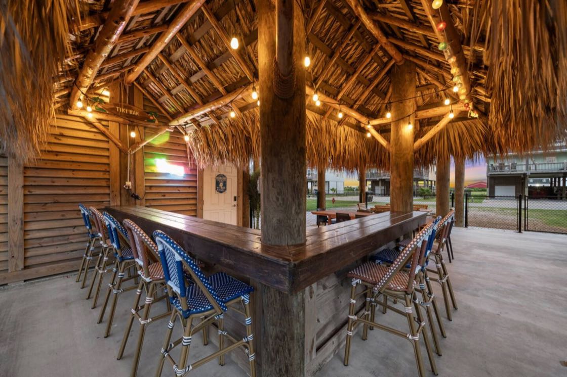 Covered tiki bar under the house