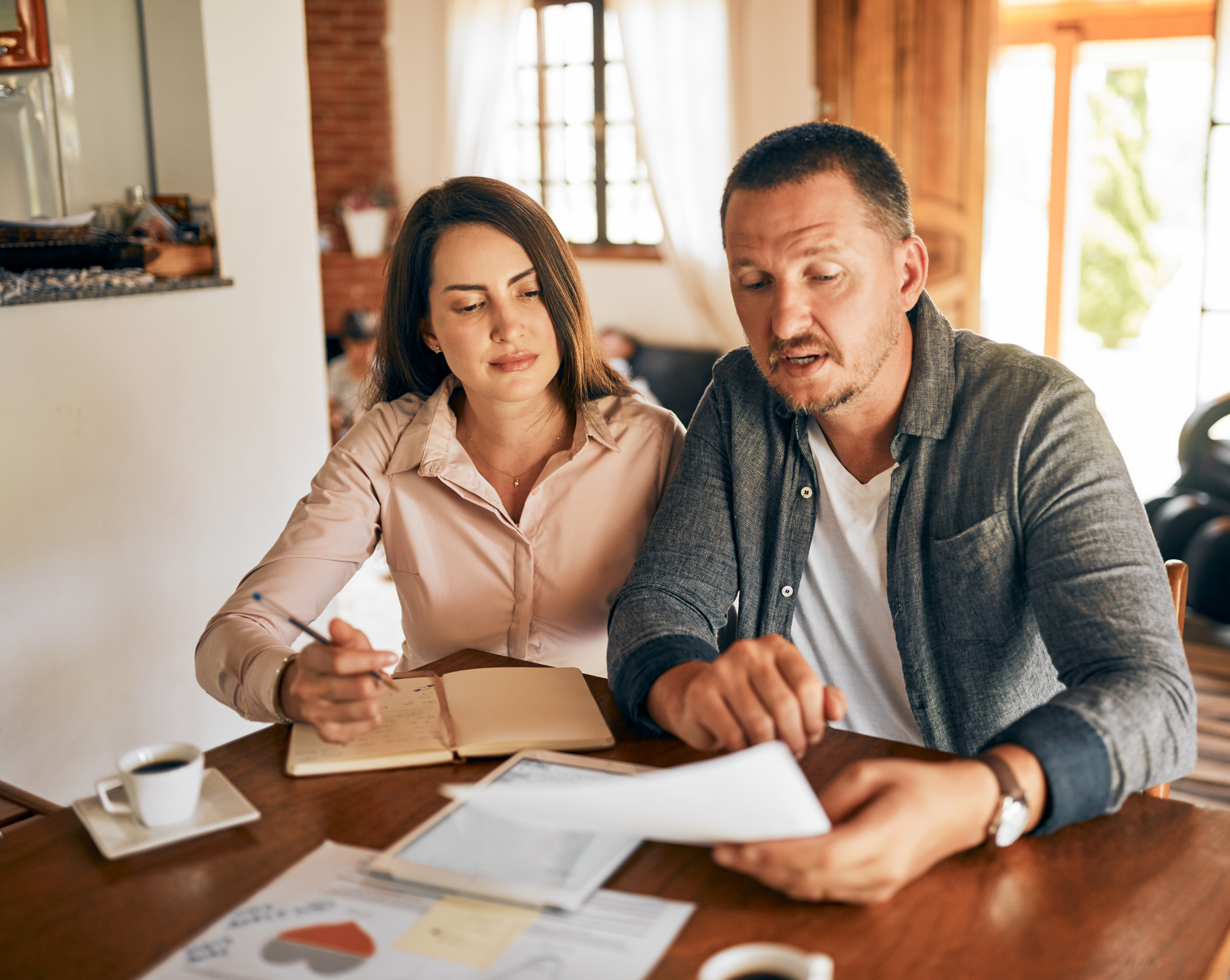 Couple reviewing financial documents together
