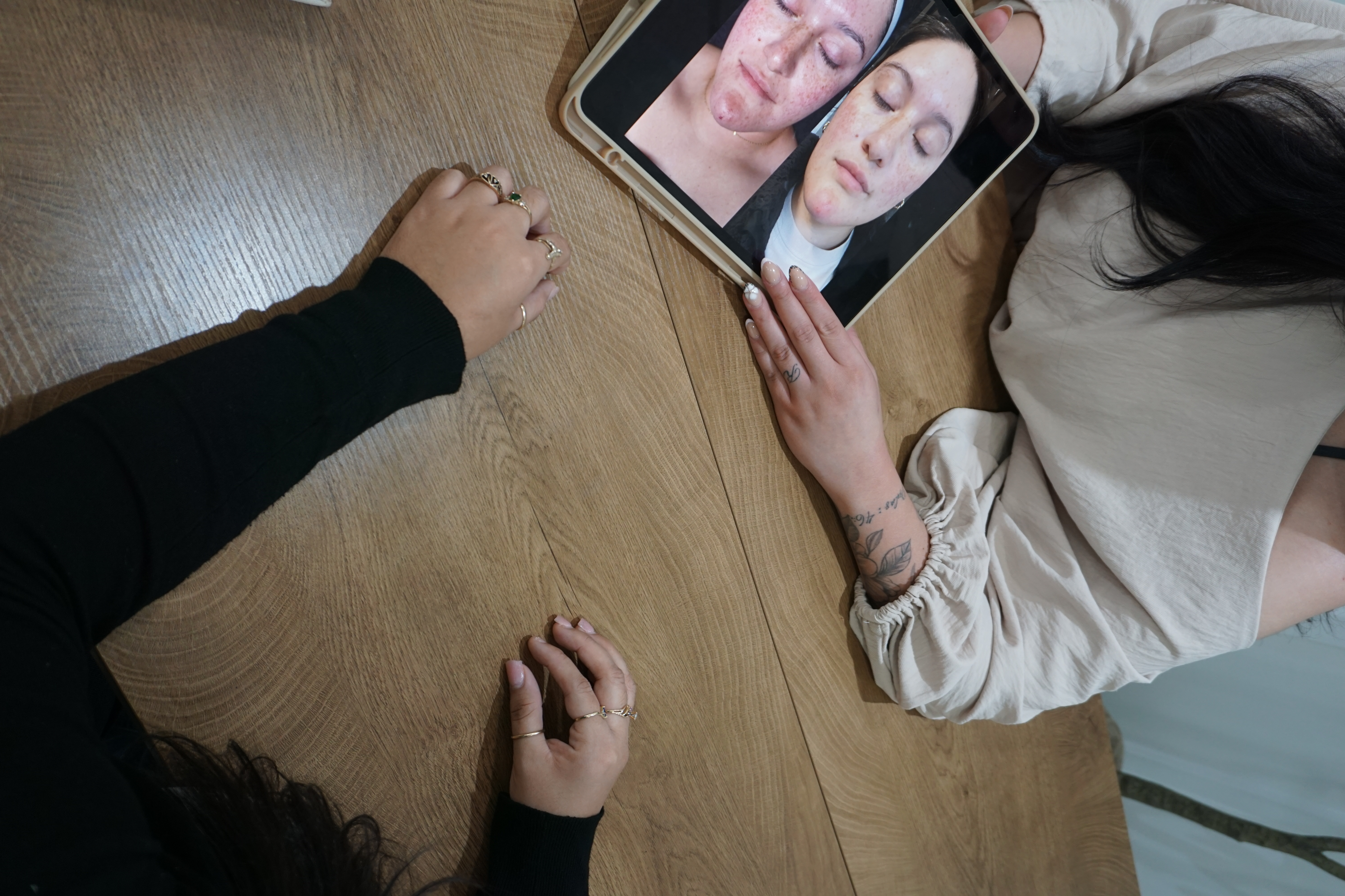 Bianca reviewing a client’s skin progress during a consultation