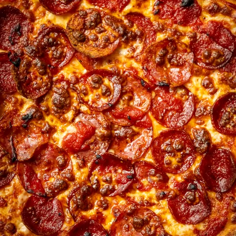 Overhead close-up of a pepperoni pizza from Food Corp