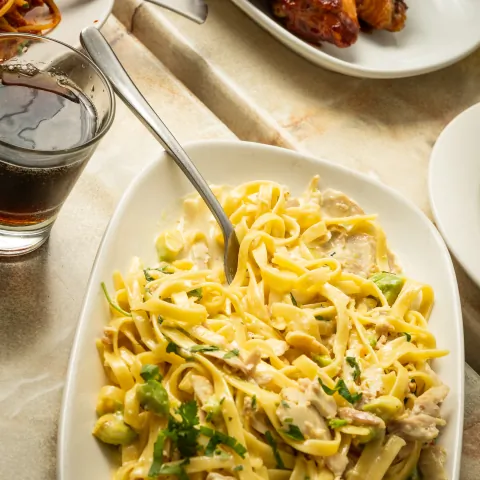 Creamy chicken fettuccine pasta with fresh herbs