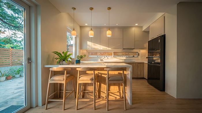 modern luxury kitchen design with precise panel alignment, warm wood and stone materials, millimeter-perfect reveals