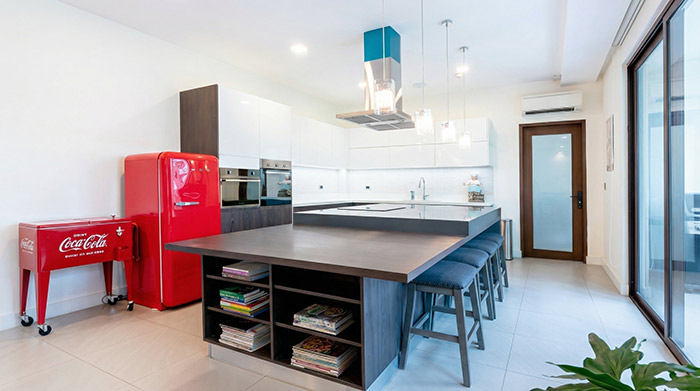 kitchen case study, warm modern kitchen with precise cabinet alignment and stone surfaces