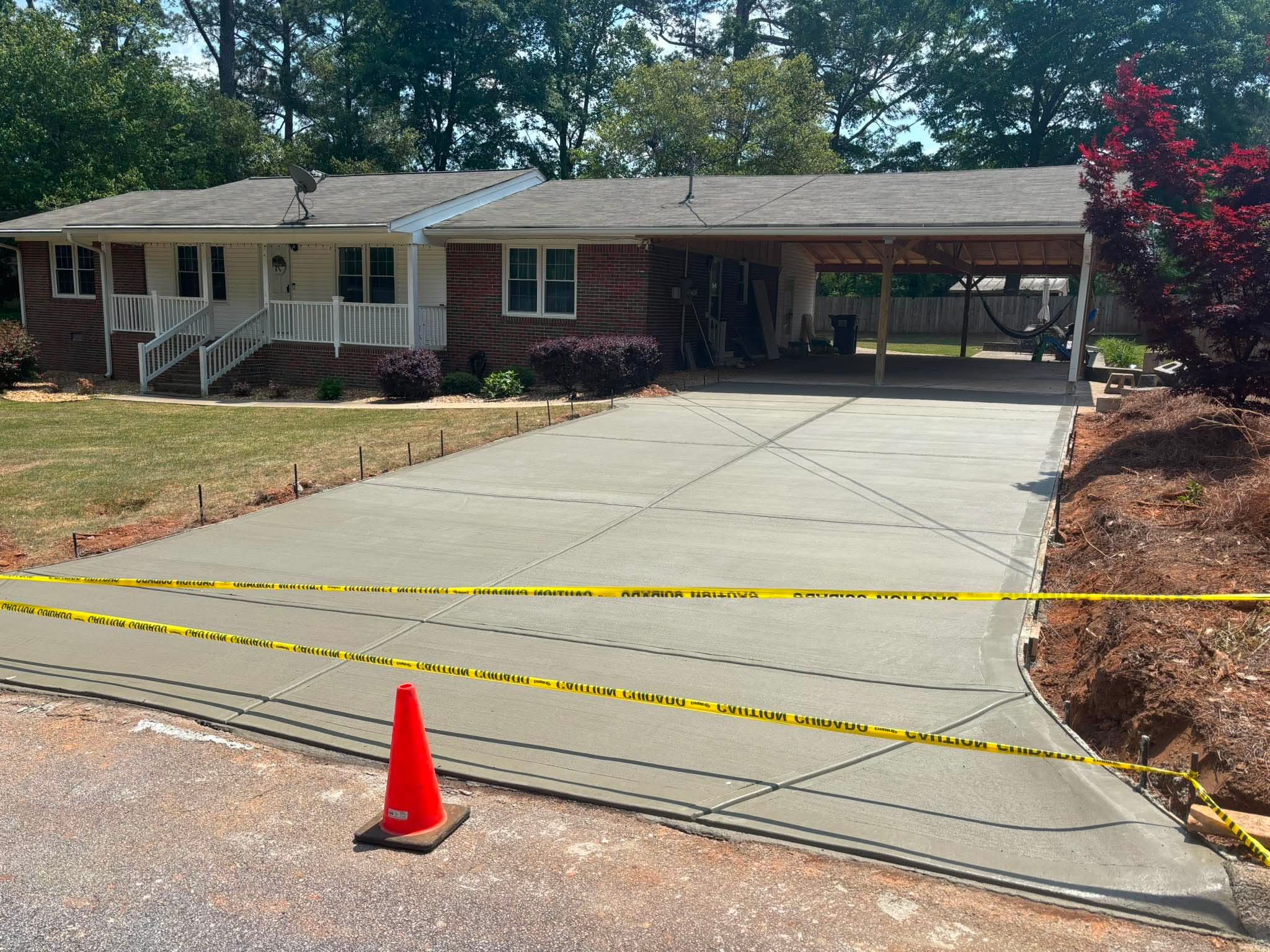 Finished concrete driveway completed by Gomez Concrete Service