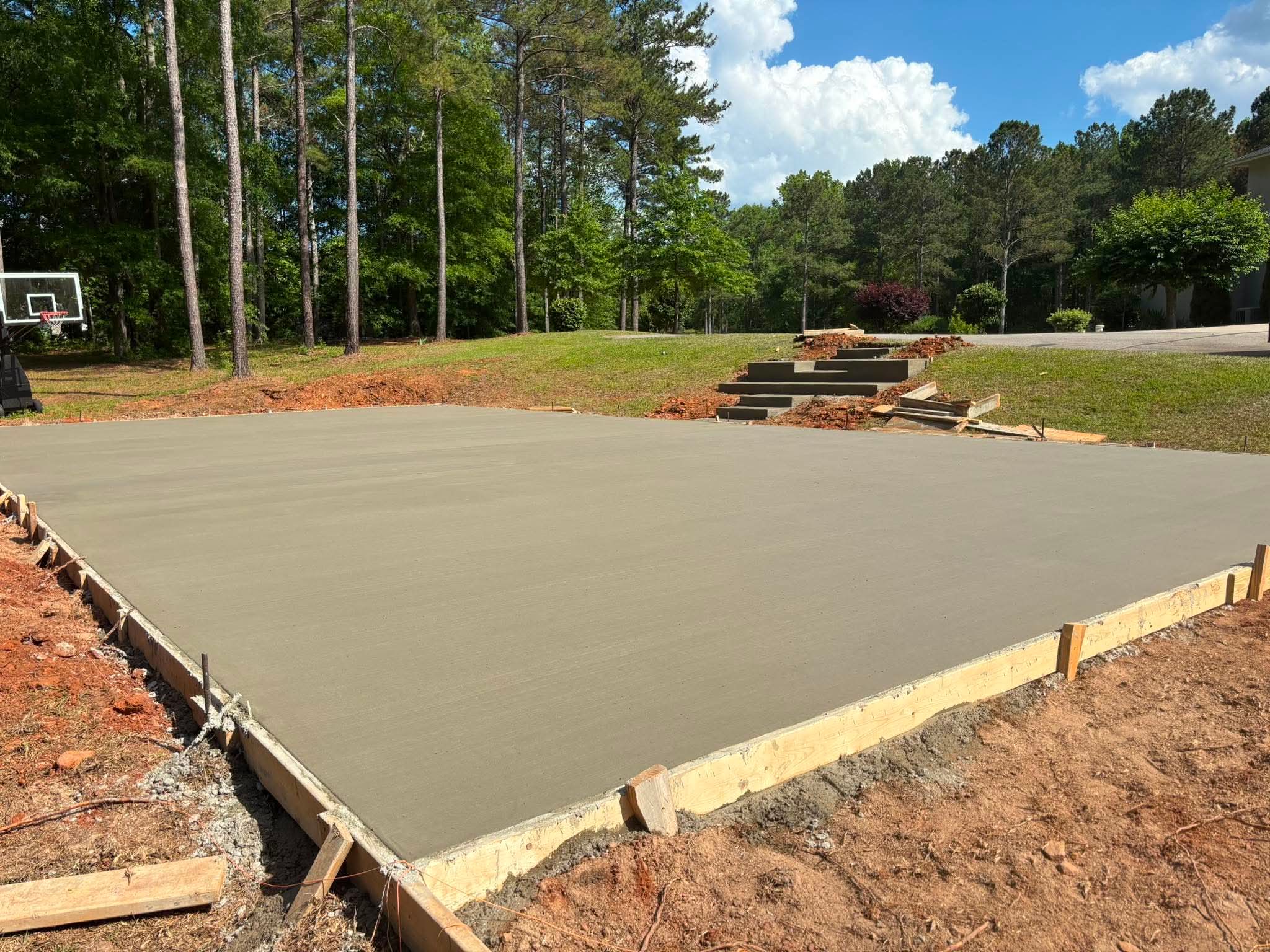 Finished concrete pad or court