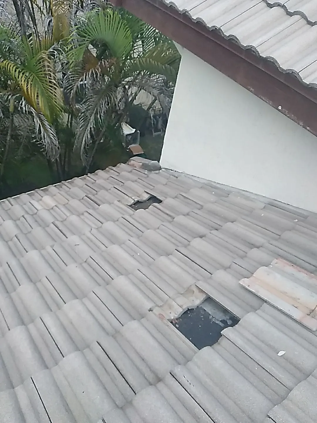 Damaged roof section before repair