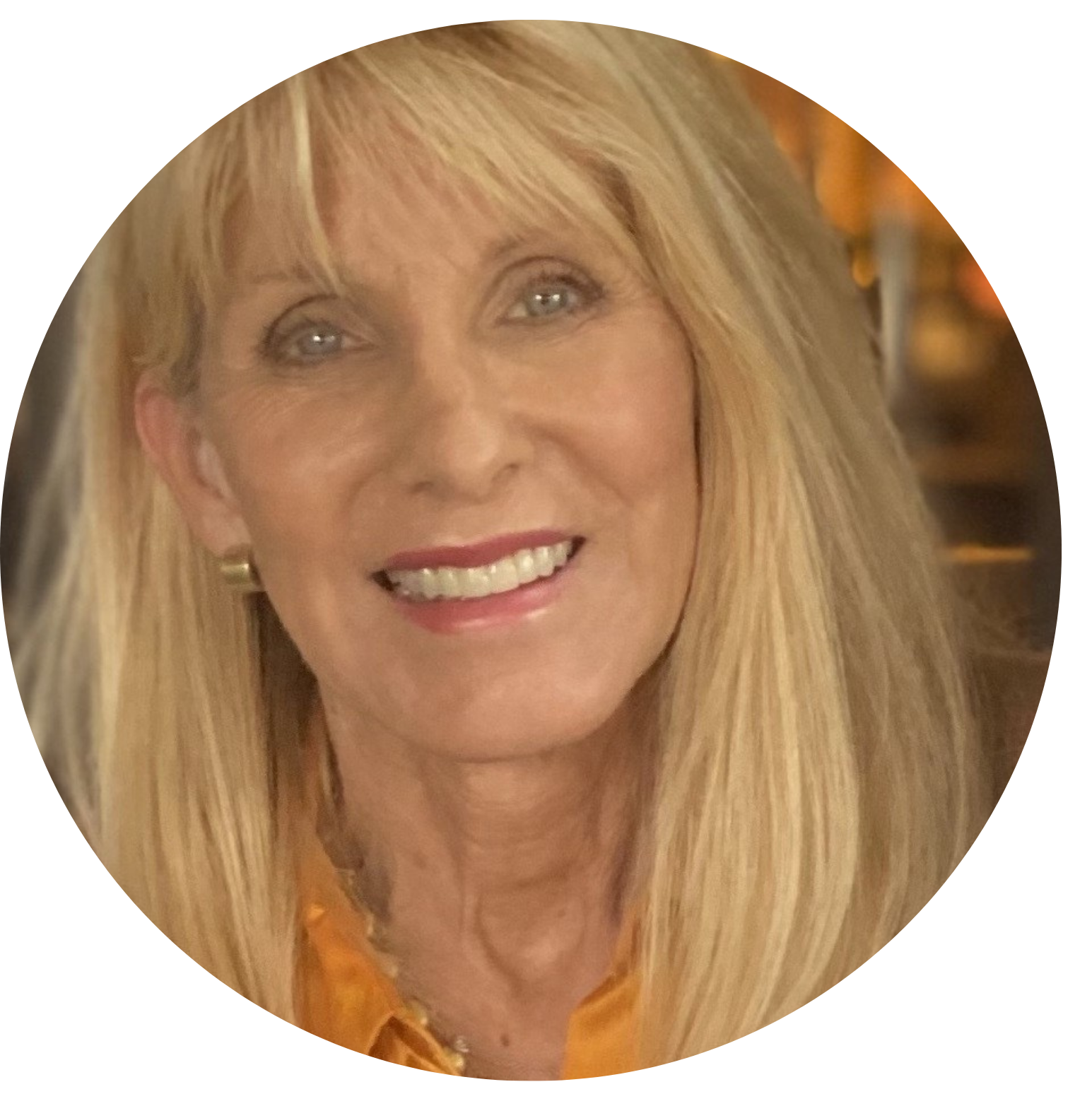 Close-up of smiling woman’s face, radiating warmth and personal growth