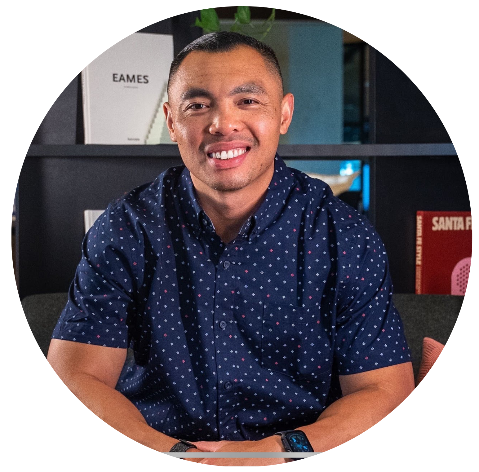 Confident man smiling at camera in a professional environment, representing clarity and transformation