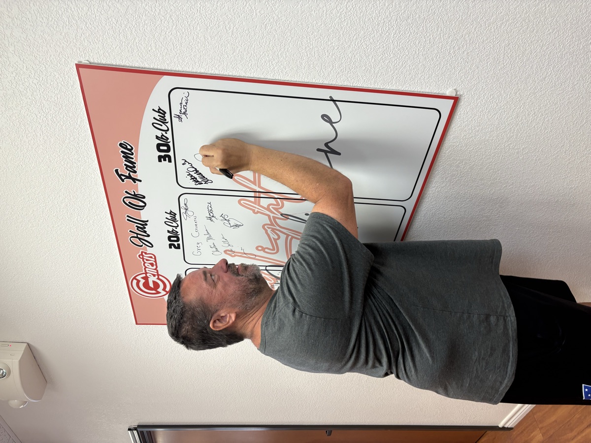 Jeff signing the wall at 30 pounds lost
