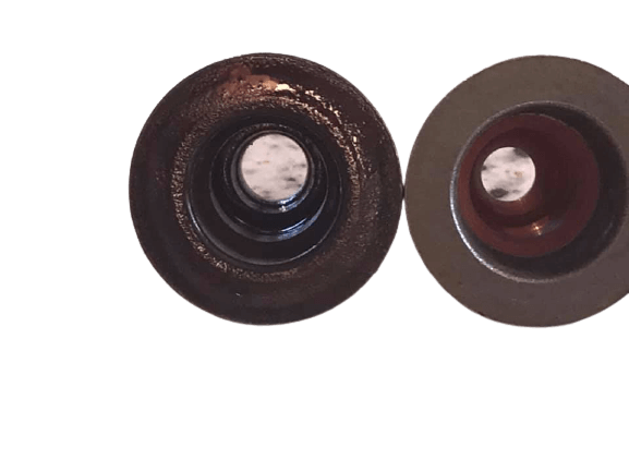 A comparison image showing an old and worn valve seal on the left and a new one on the right.