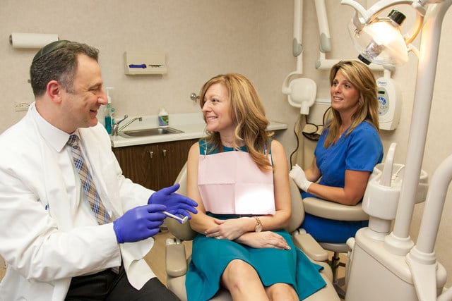 Dr. Jody Bardash discussing dental implant treatment options with a patient in Fair Lawn NJ