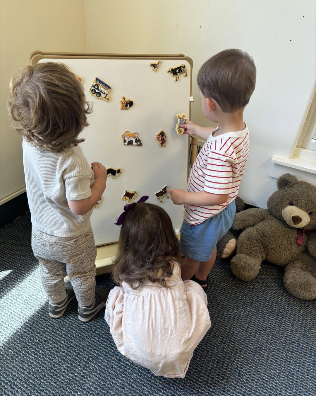 Toddlers exploring and discovering at United Friends School