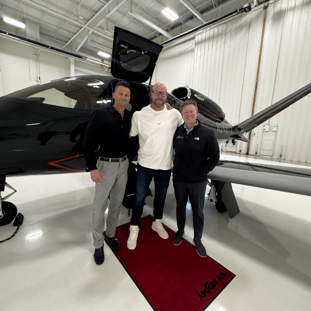 Jesse Johnson-Brower with private aviation company owners