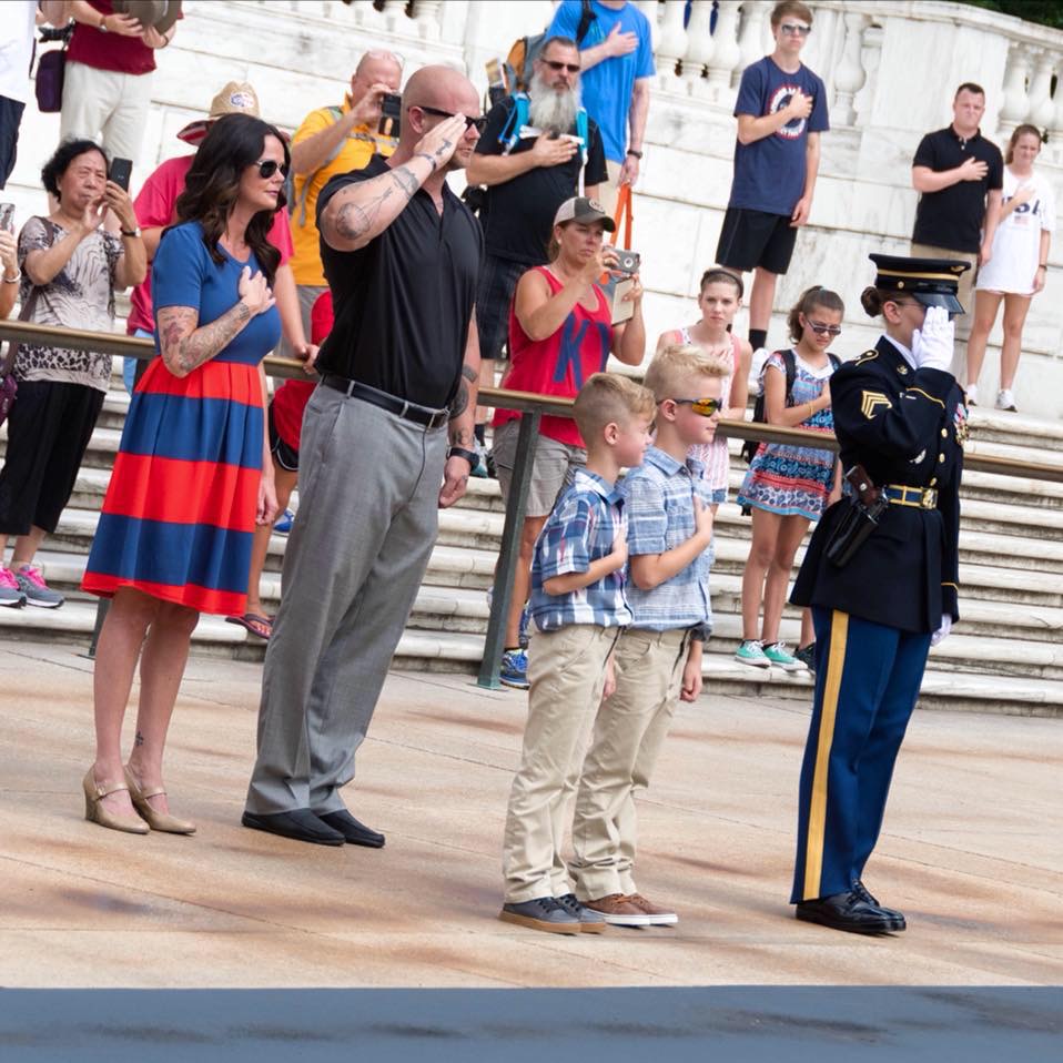 Tara Johnson-Brower with Jesse, Taggan and Briggs laying a wreath at the Tomb of the Unknown Soldier