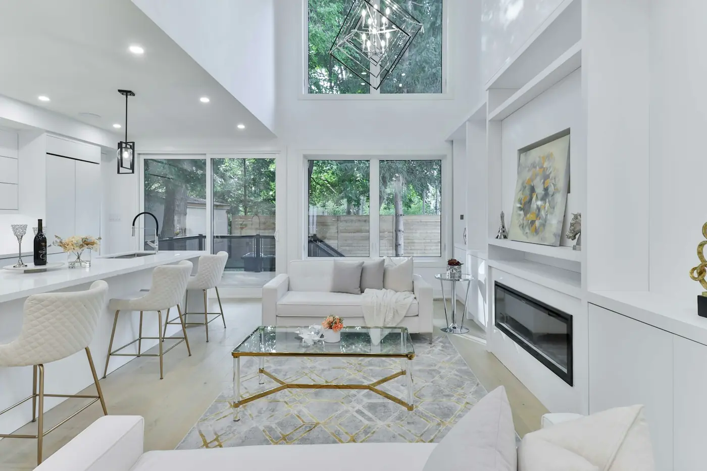 A restrained living room with a linear fireplace and generous negative space.