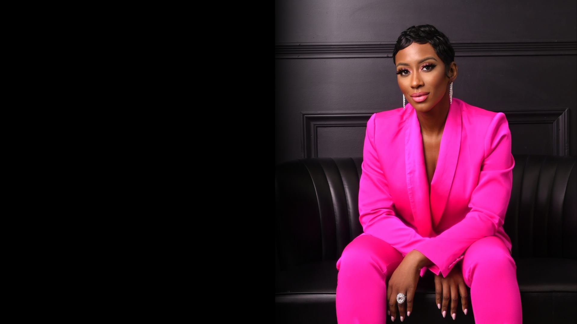 Cloé Luv wearing her signature pink suit