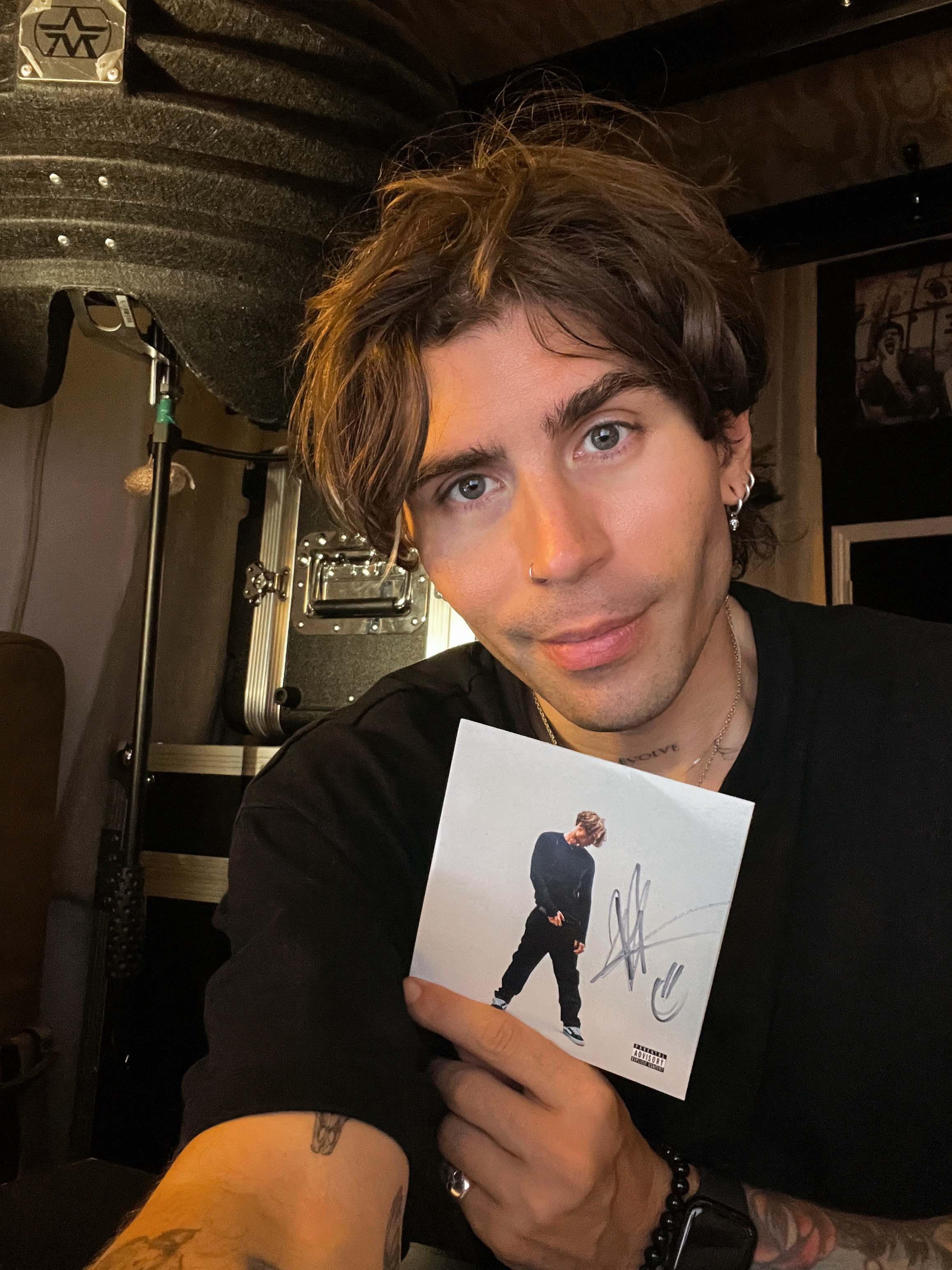 Danny holding a signed copy of the mixtape
