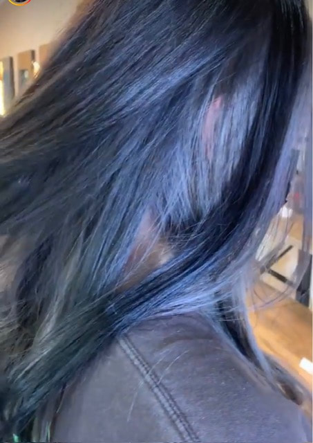 Dark blue-toned hair close-up.