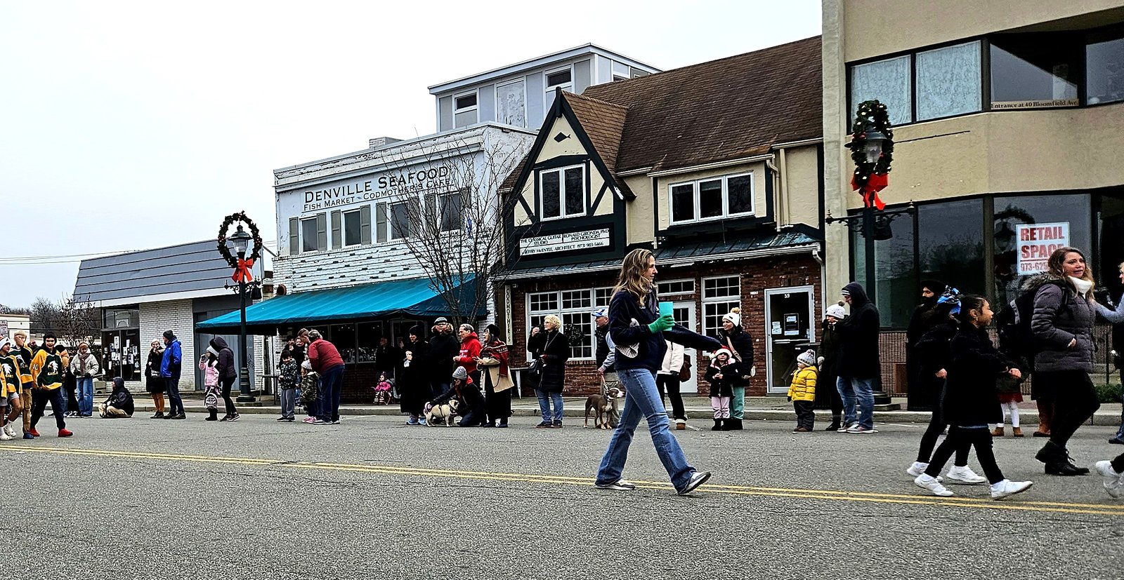 Spectators lining the street in downtown Denville, NJ for the annual Holiday Parade