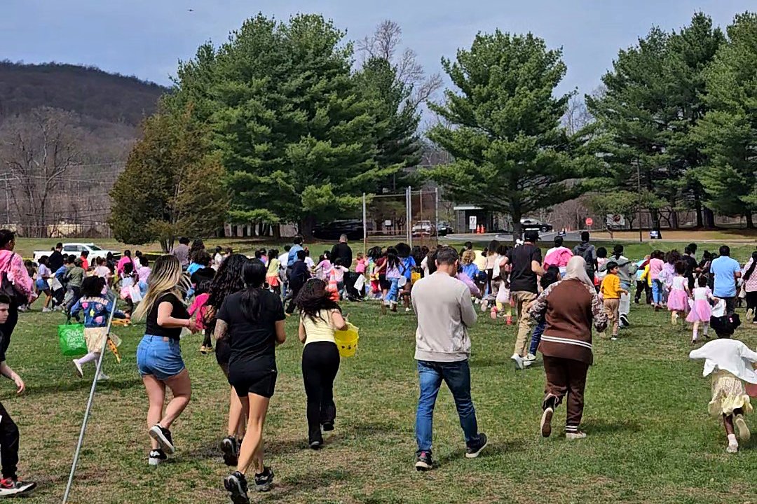 Crowd heading onto the field at the Christ Church Easter egg hunt in Rockaway Township, NJ