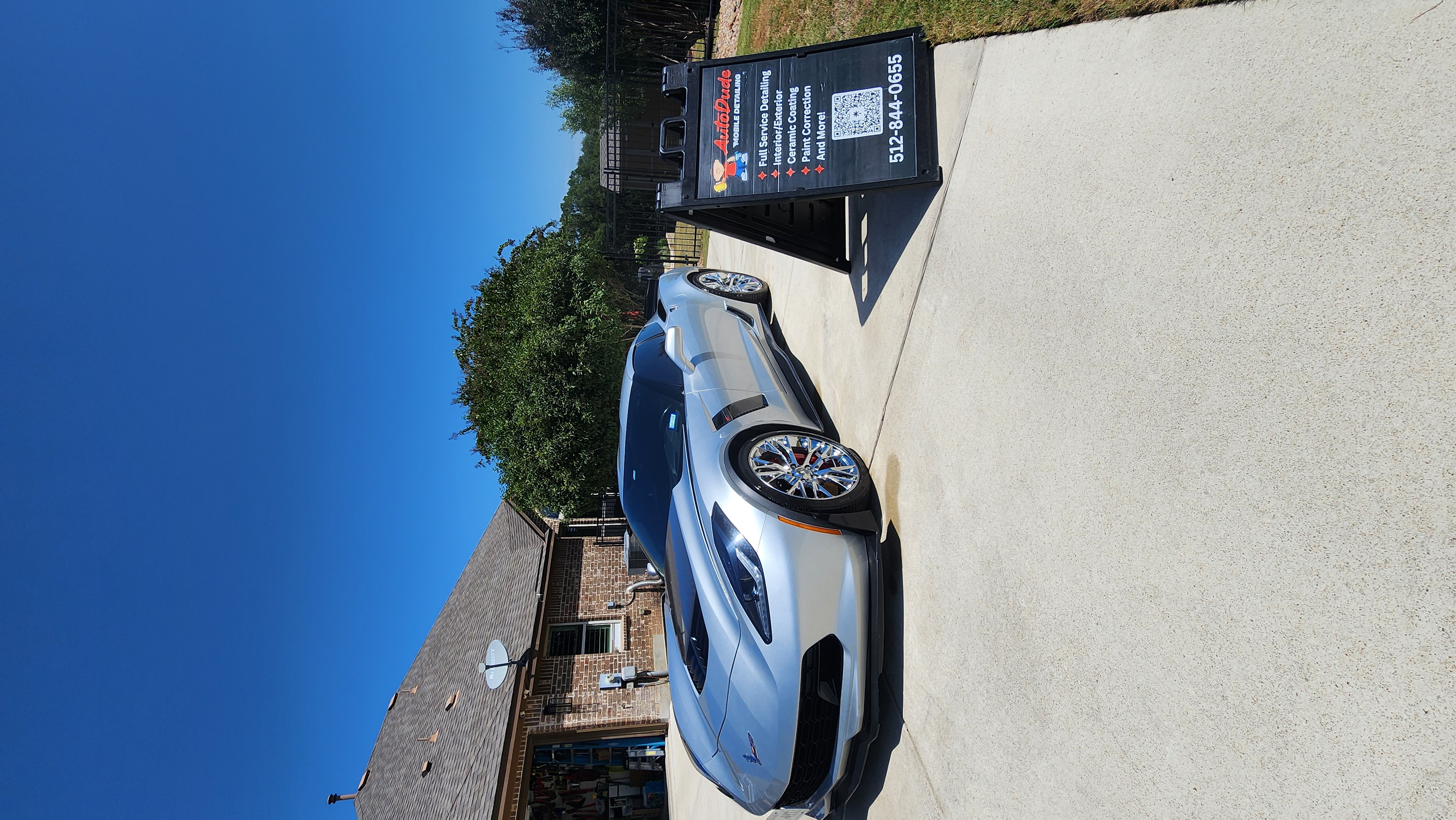 Professional detailer performing maintenance on ceramic coated vehicle in New Braunfels Texas