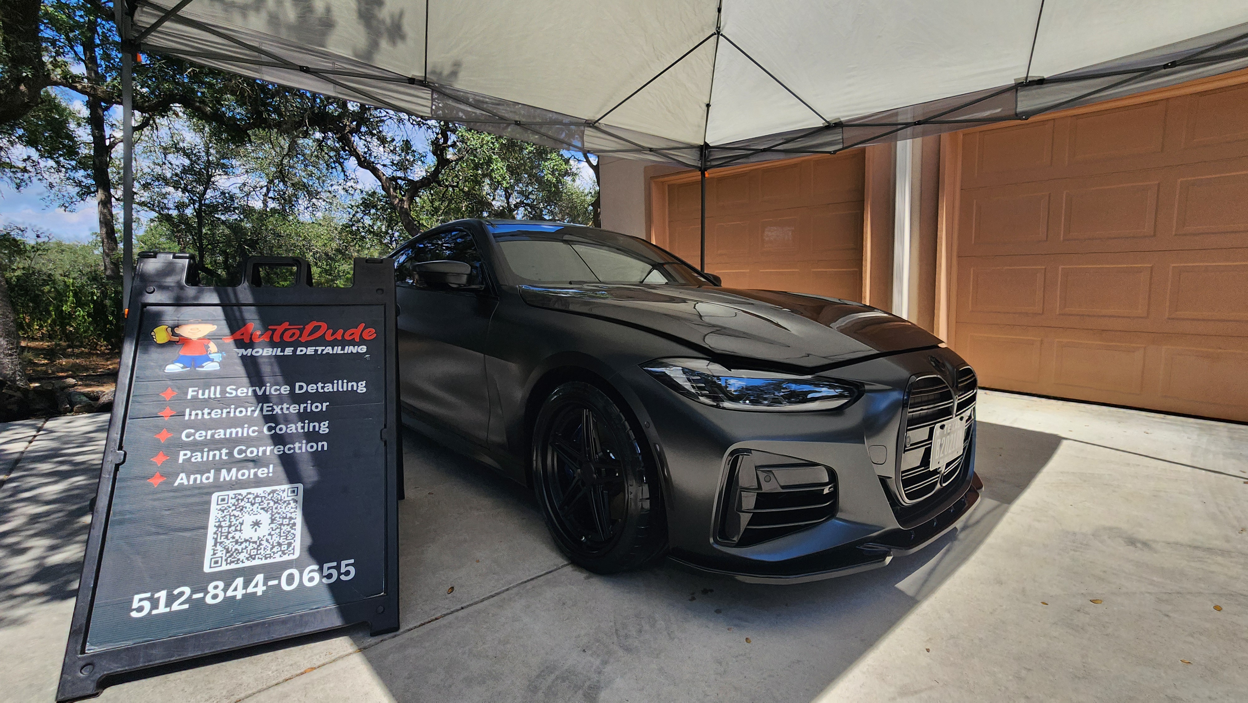 Hand washing a ceramic coated car using proper two-bucket method