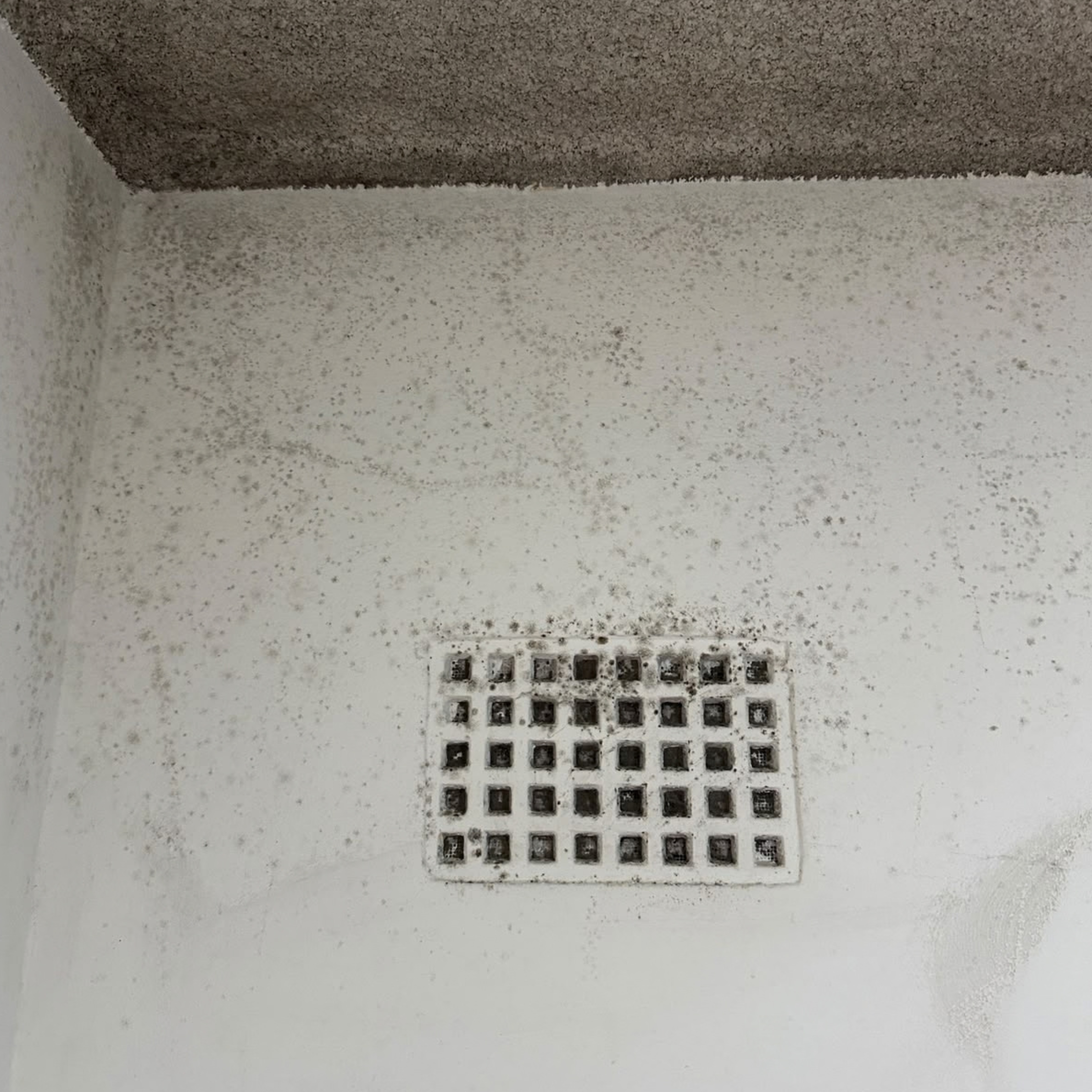 Mould spots around a bedroom wall vent