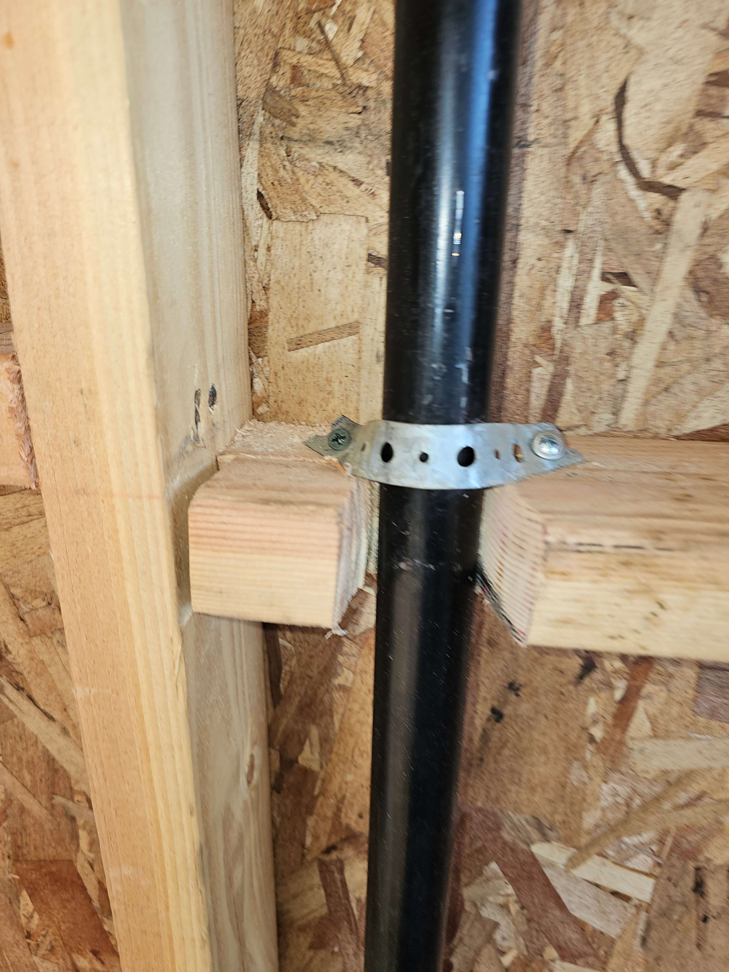 Pomona — pipe strap detail on framing