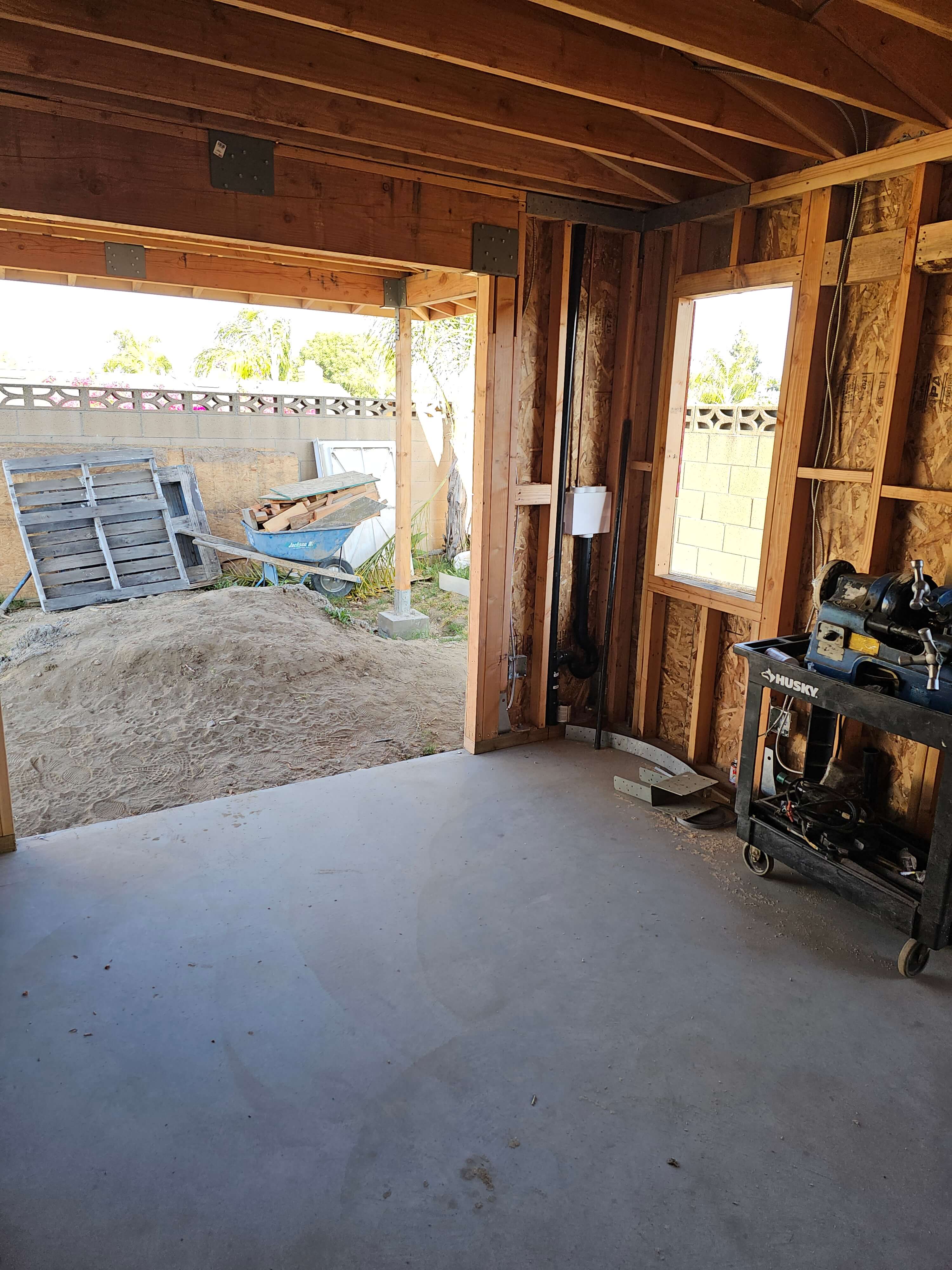 Ontario — interior looking out to dirt backyard with wheelbarrow