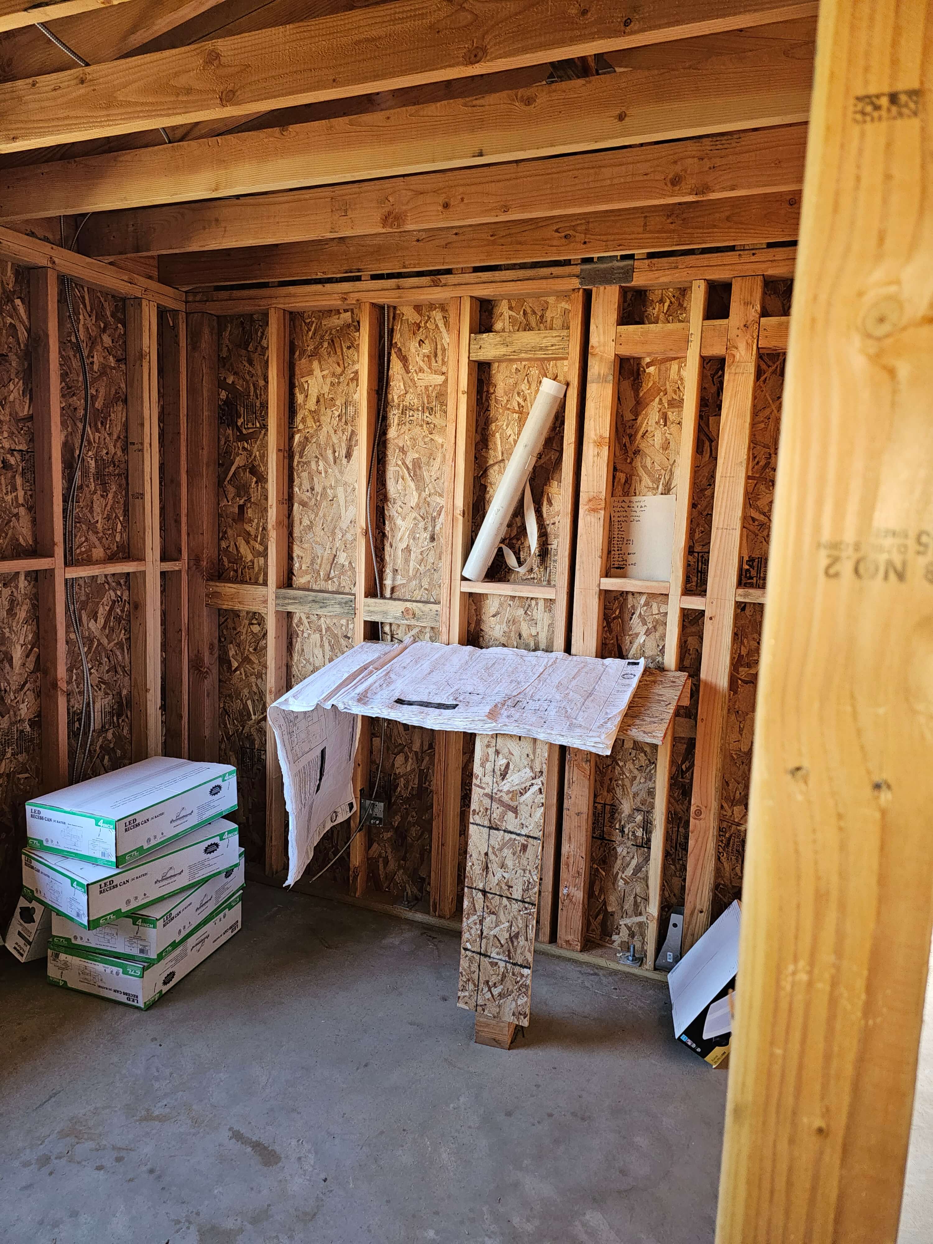 Ontario — framed workspace with blueprints and supplies