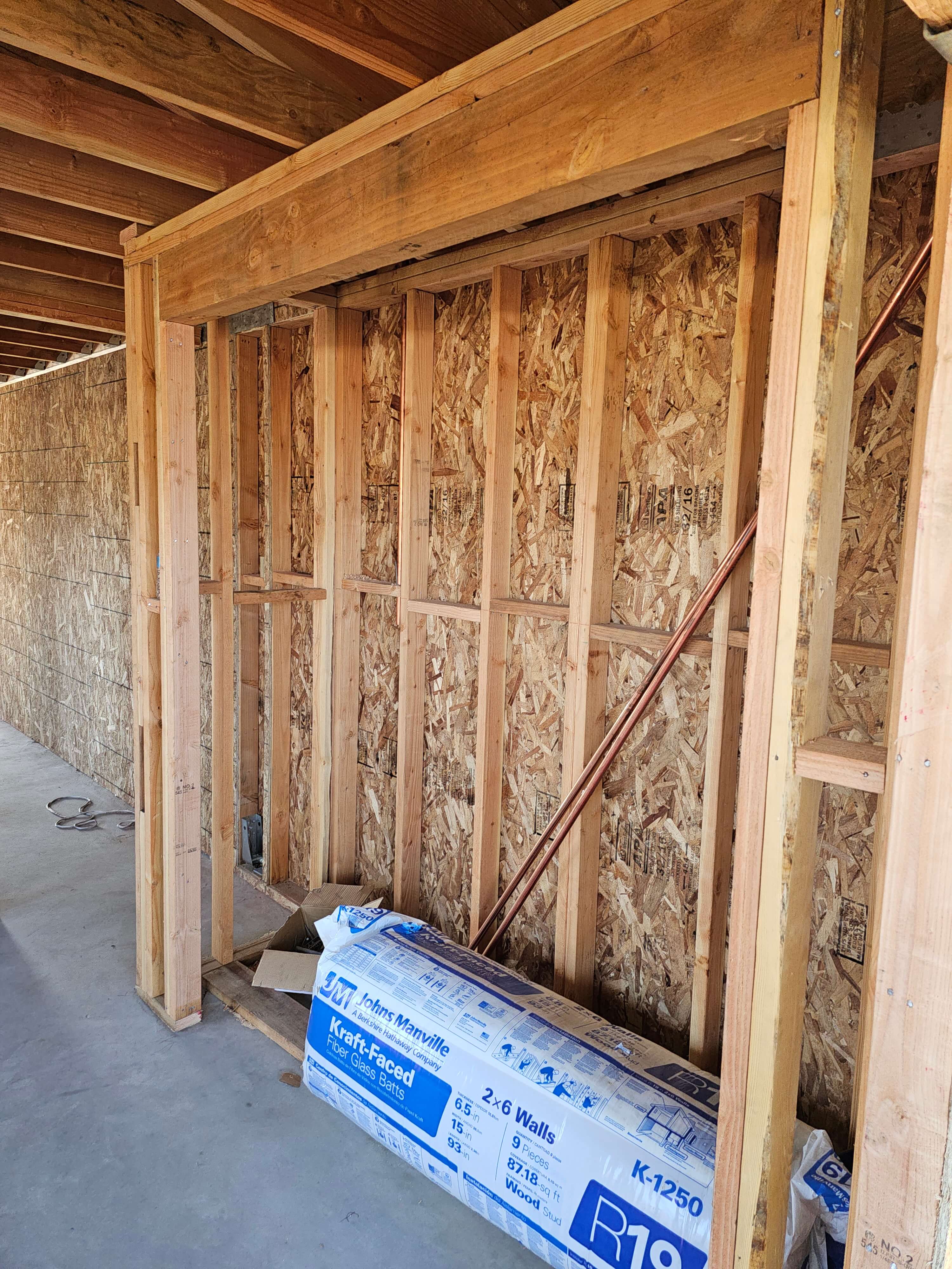 Ontario — structural header, copper pipes and insulation roll