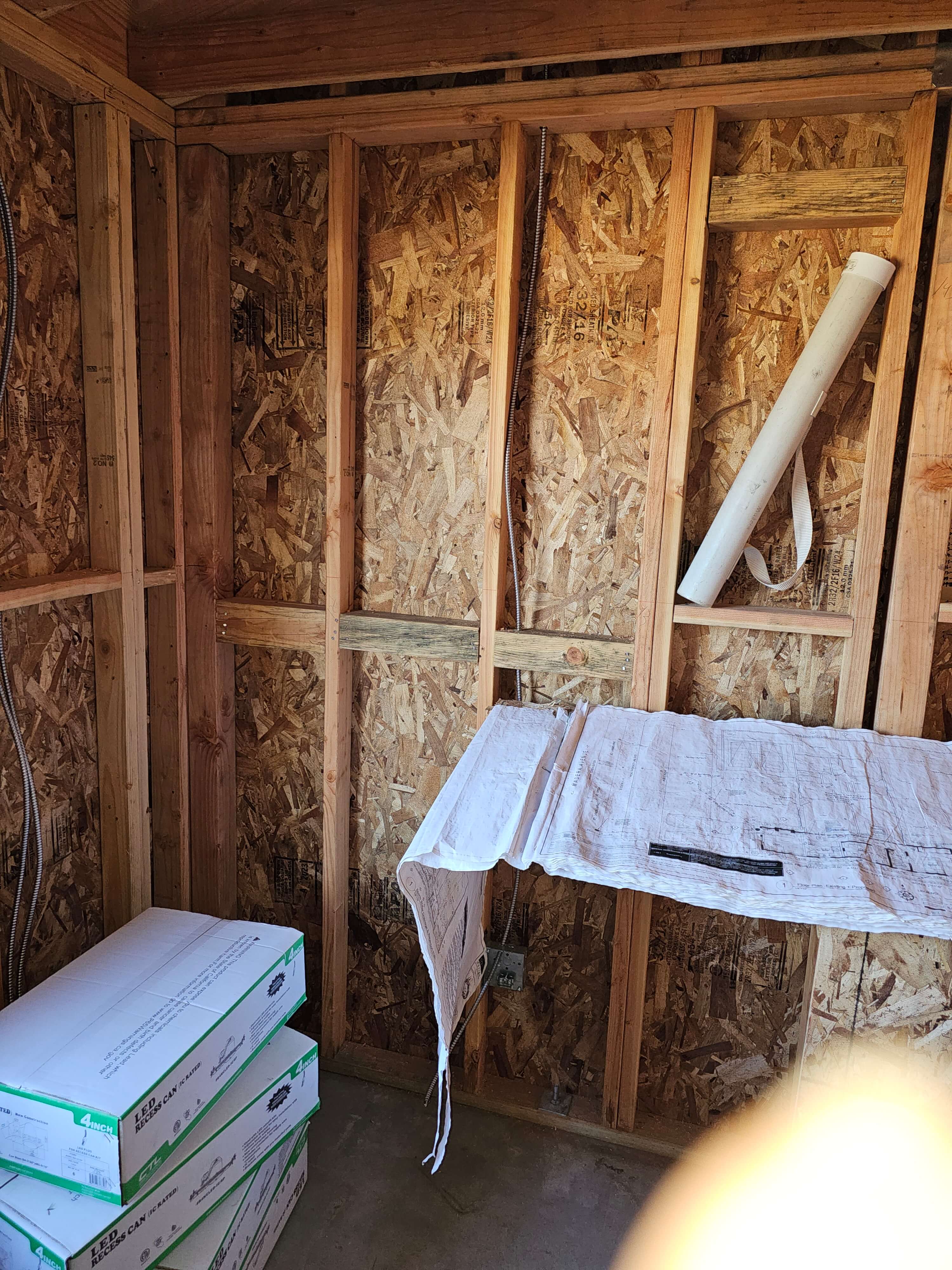 Pomona — OSB framing with LED recessed light boxes and blueprint plans