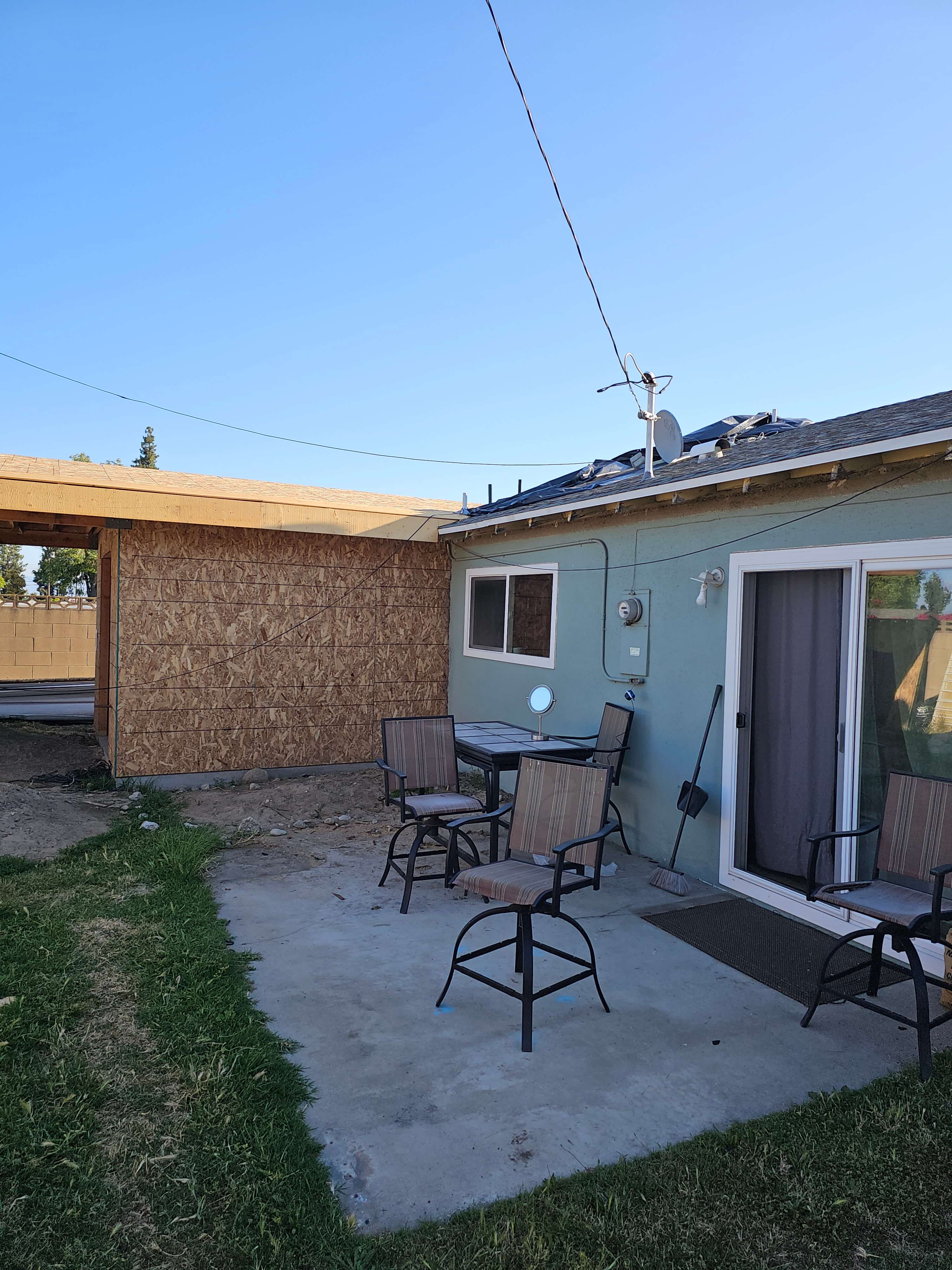 Ontario — new OSB-framed ADU addition attached to existing stucco house