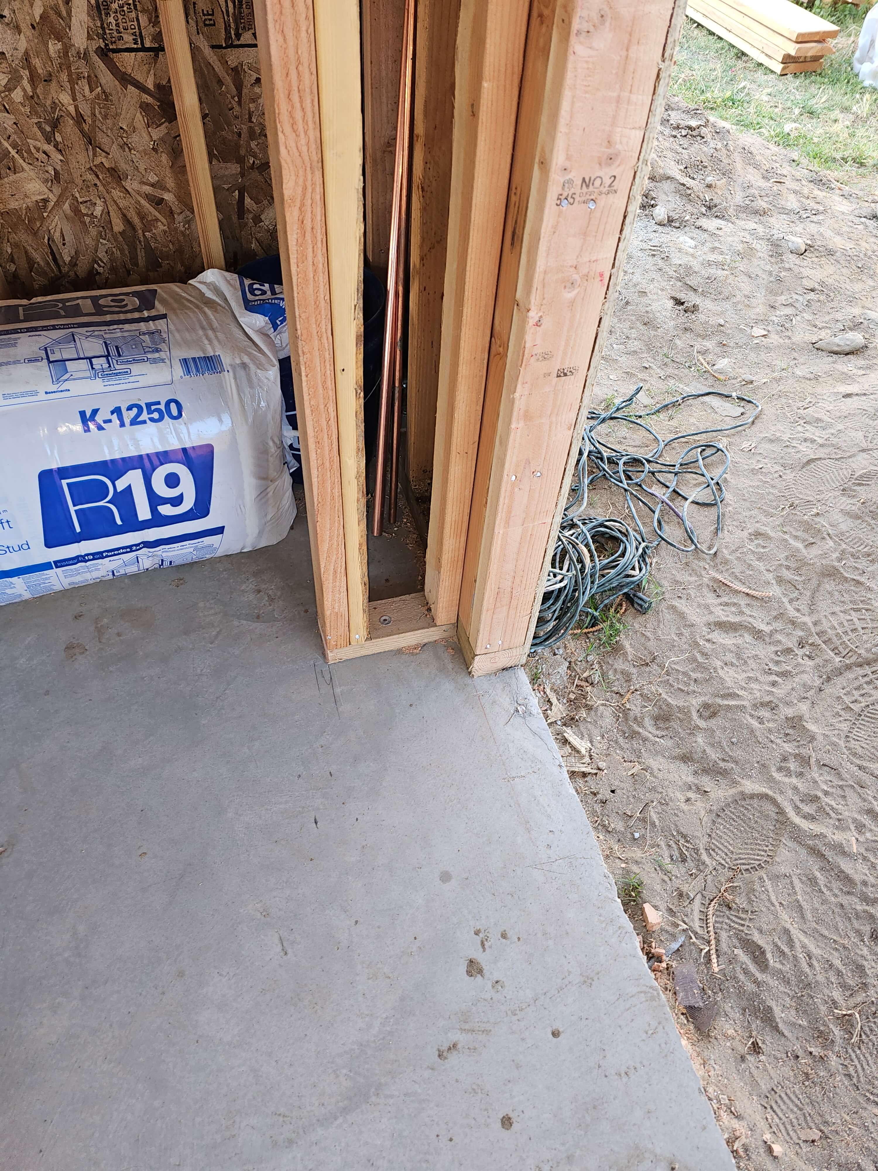 Pomona — framed corner with copper plumbing in wall cavity and R-19 insulation