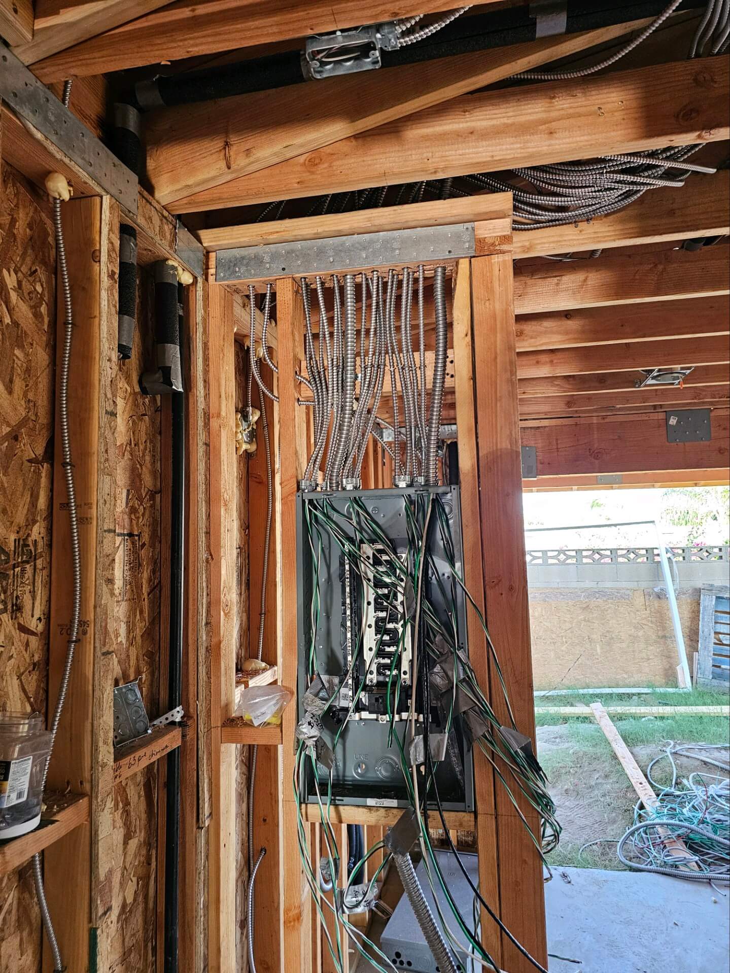 Pomona — electrical subpanel installation in framed wall cavity