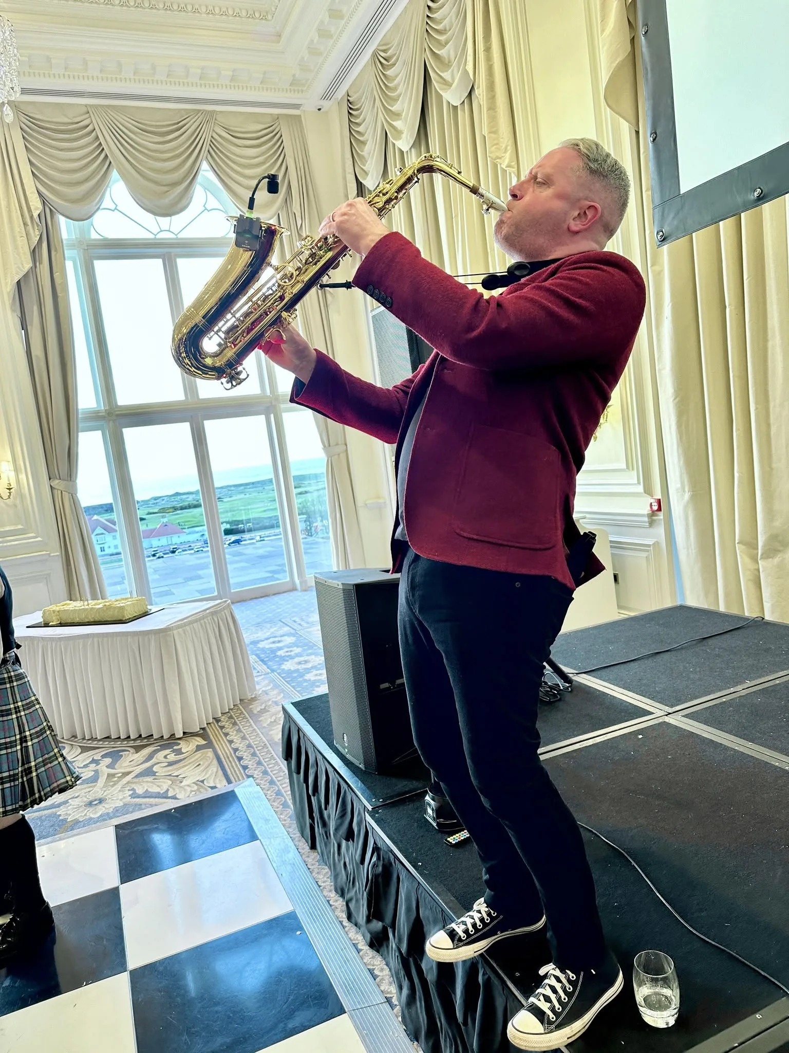 AWDJ saxophonist performing at a wedding