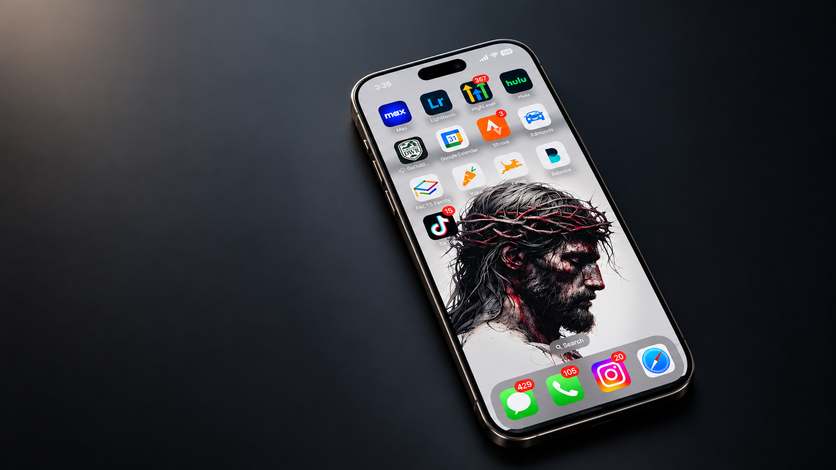 A phone lock screen showing Jesus with the crown of thorns