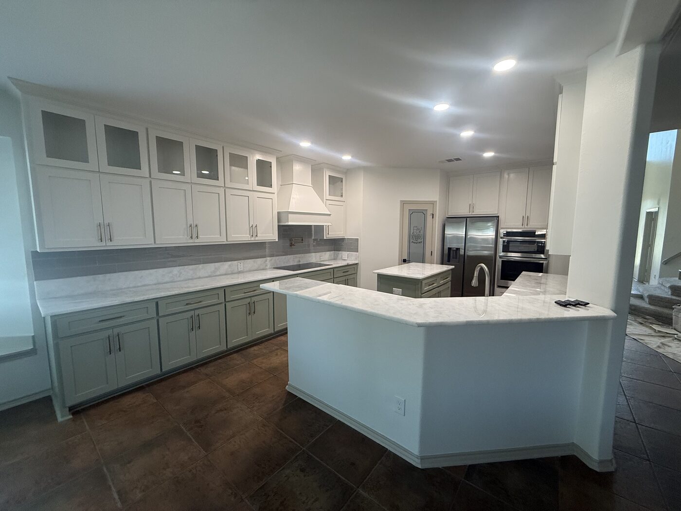Rebuilt kitchen with island and new cabinetry in the same Burleson home