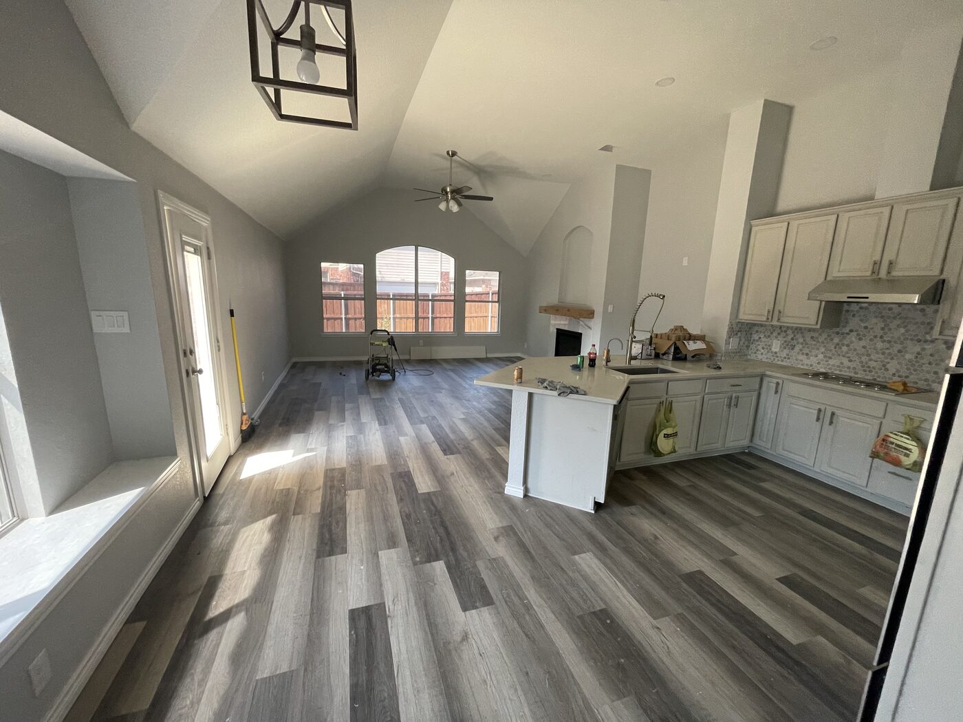 Finished kitchen with island and new cabinetry after lightning fire rebuild